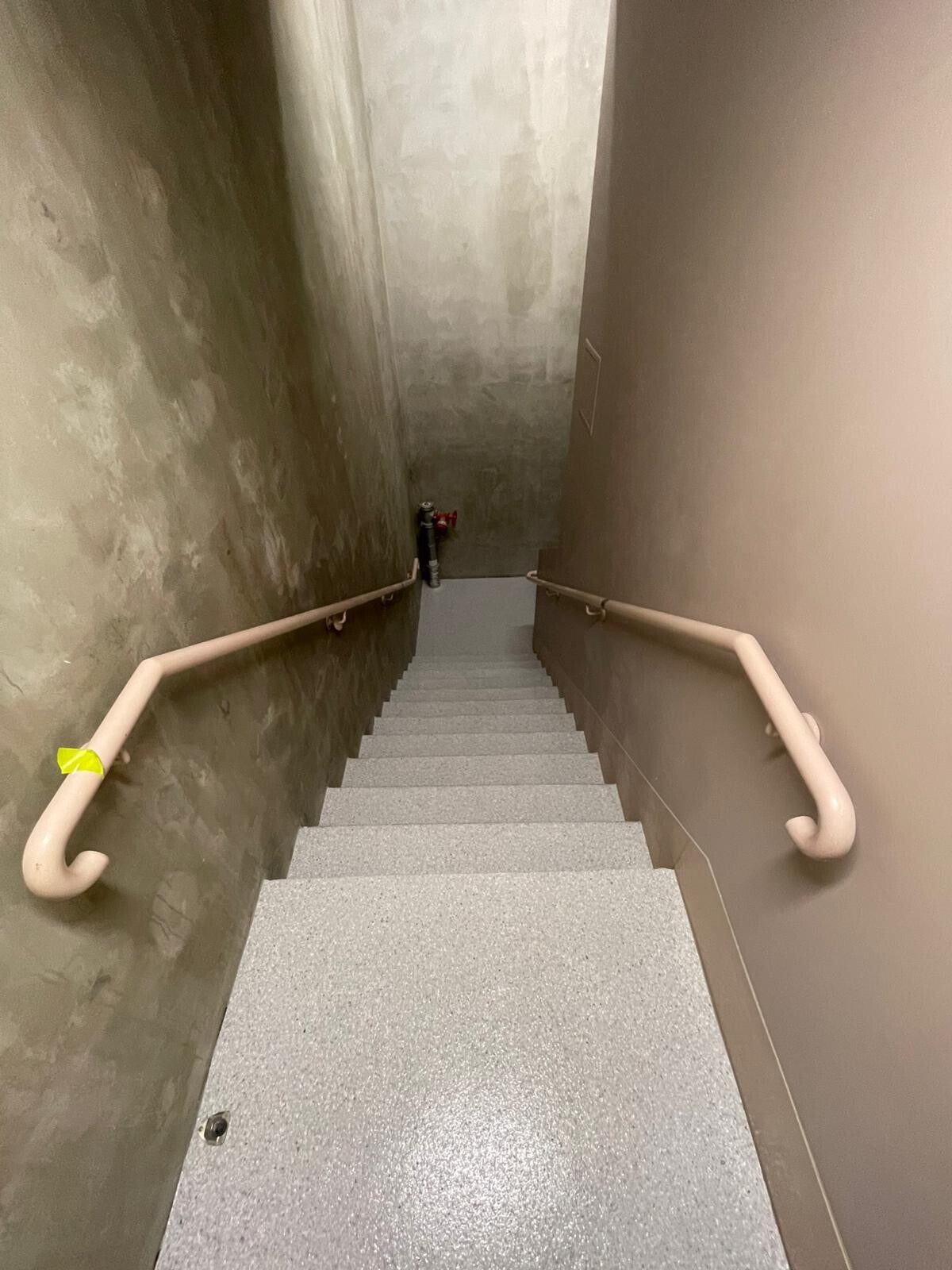 Flake epoxy stairs viewed from the landing above