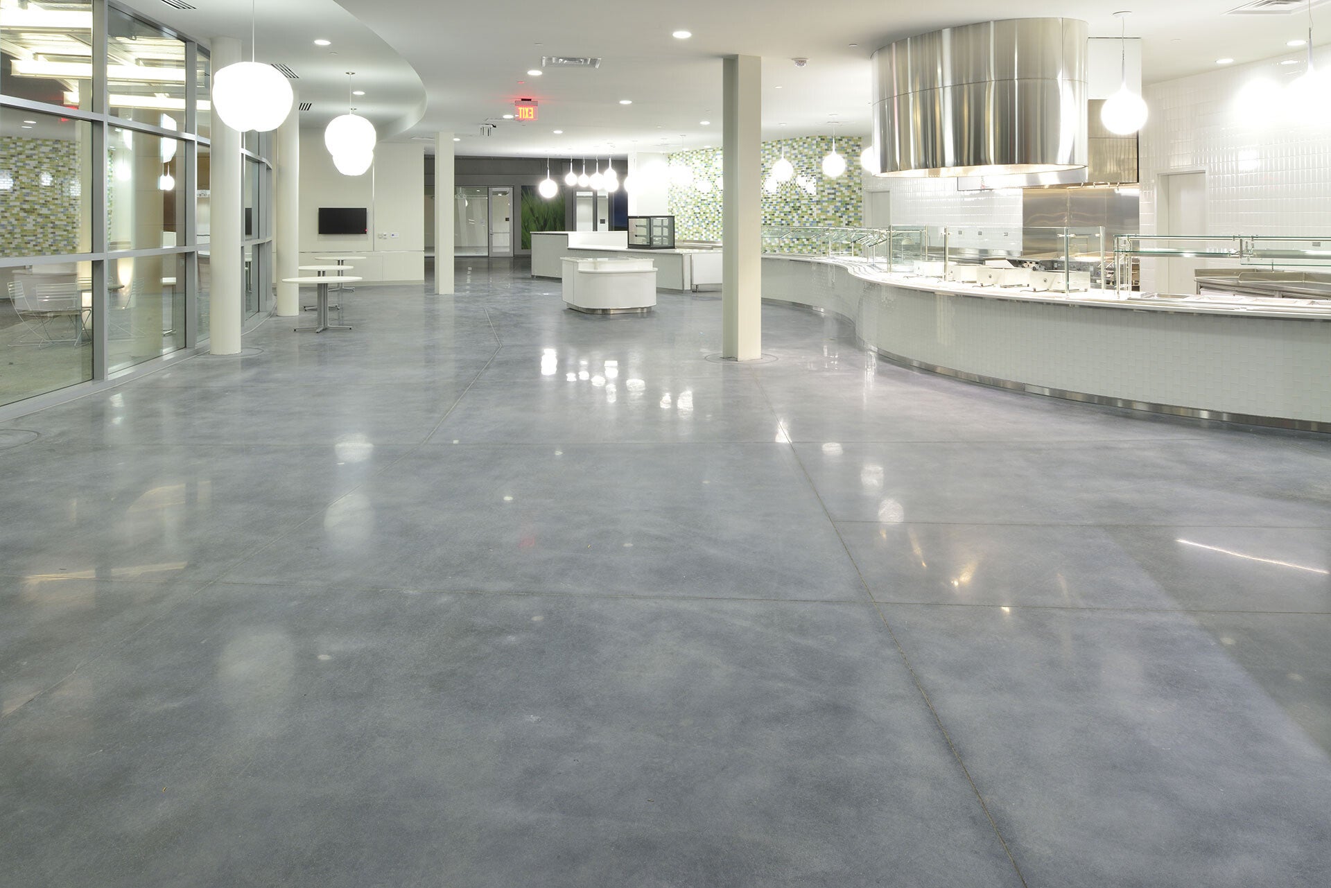 Polished concrete floor in a completed commercial fit-out by Matta Projects