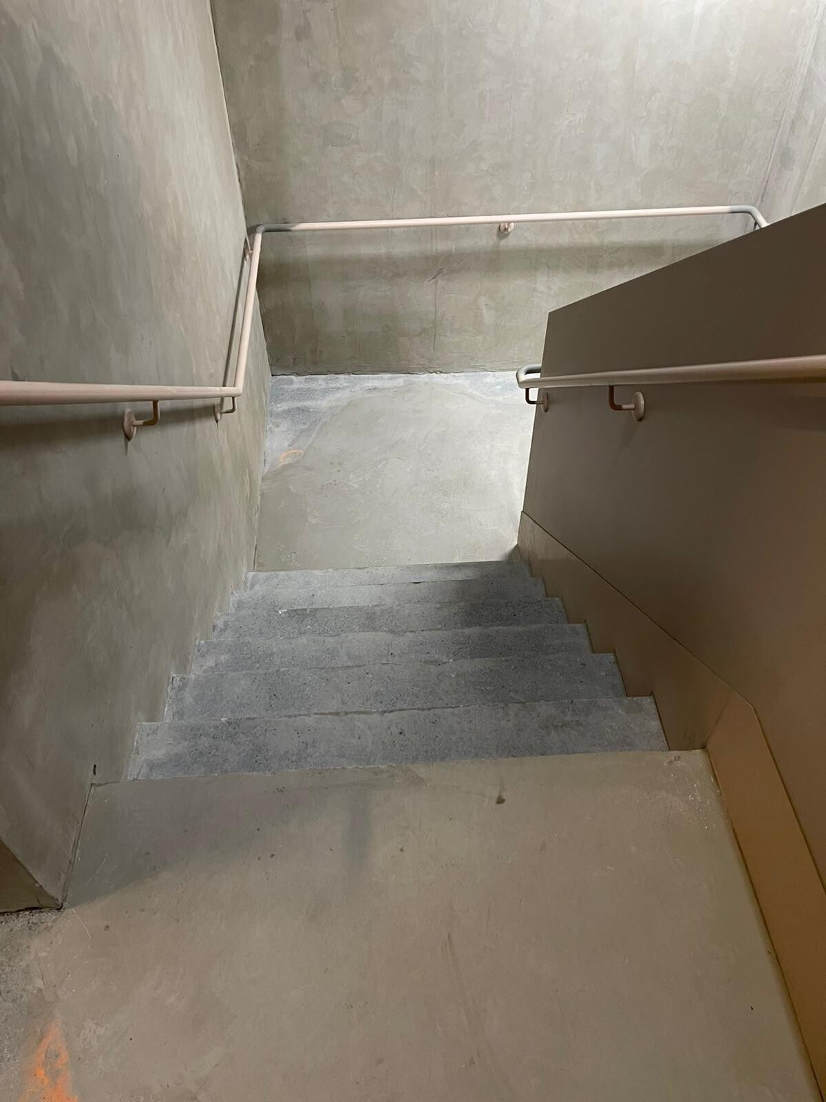Flake epoxy stairs with timber handrail