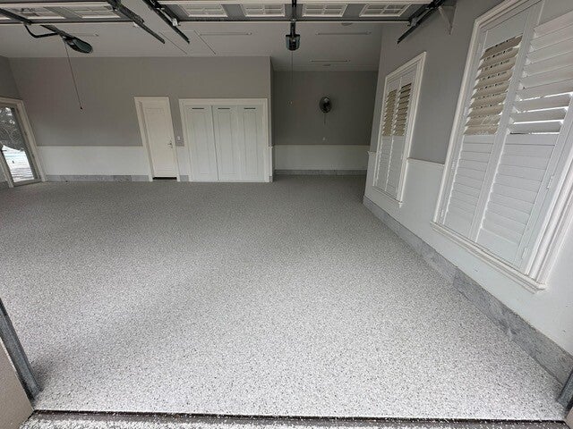 Grey flake epoxy garage floor with white walls
