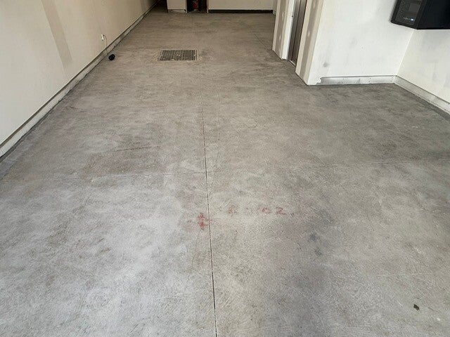 Prepared concrete slab in an unfinished interior