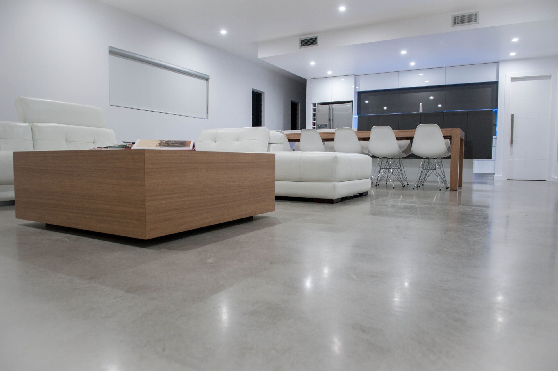 Polished concrete floor through an open-plan living area
