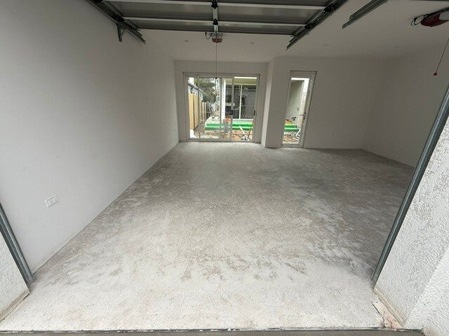 Bare concrete garage slab before coating