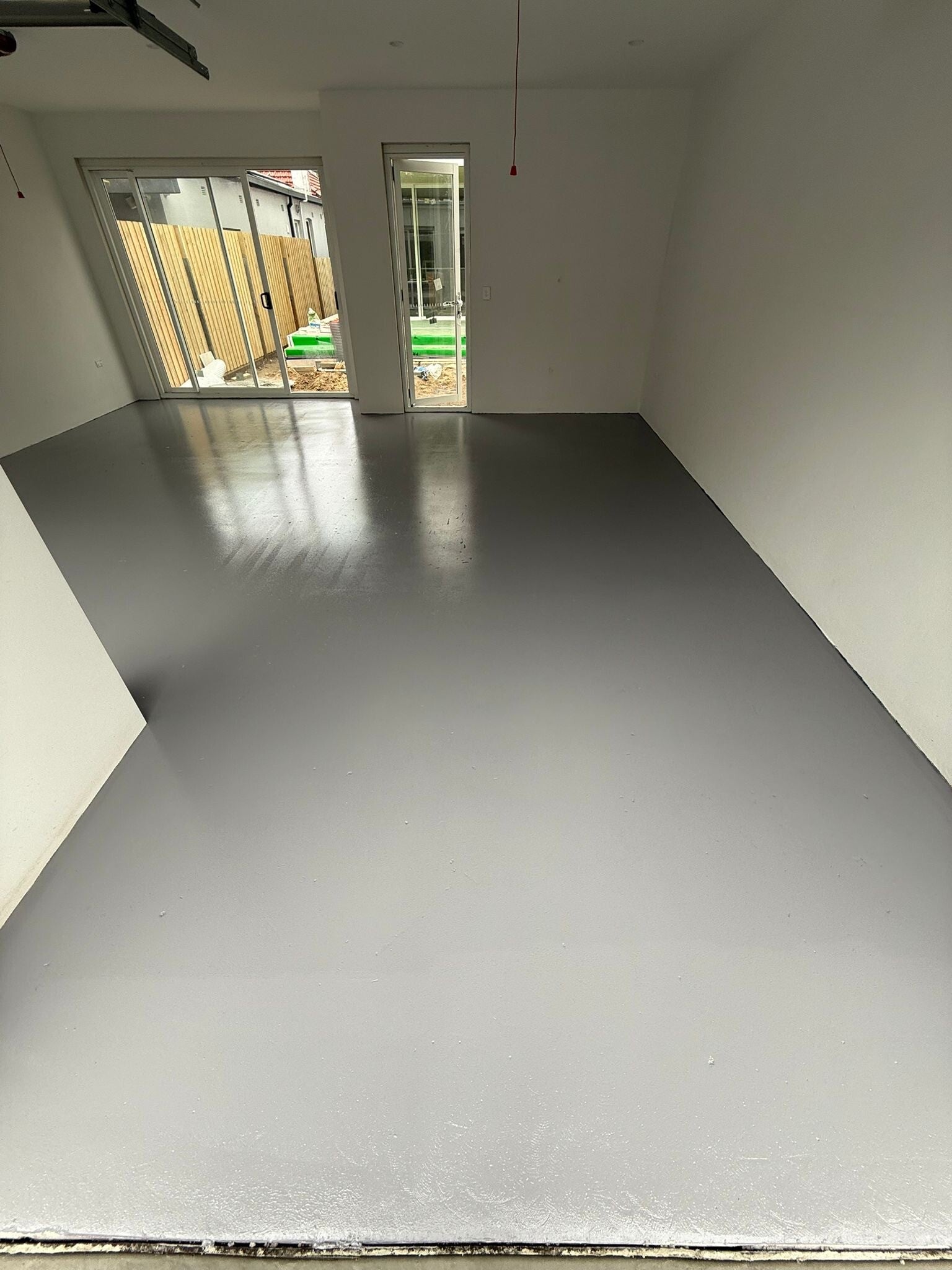 Solid colour epoxy floor finished to the wall line