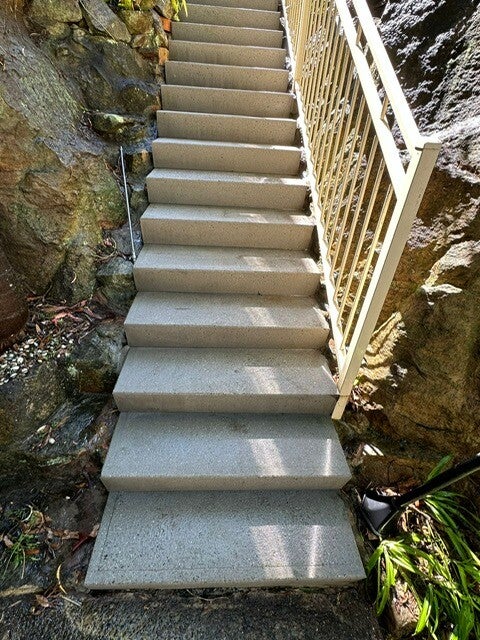 Resurfaced concrete stairs with handrail