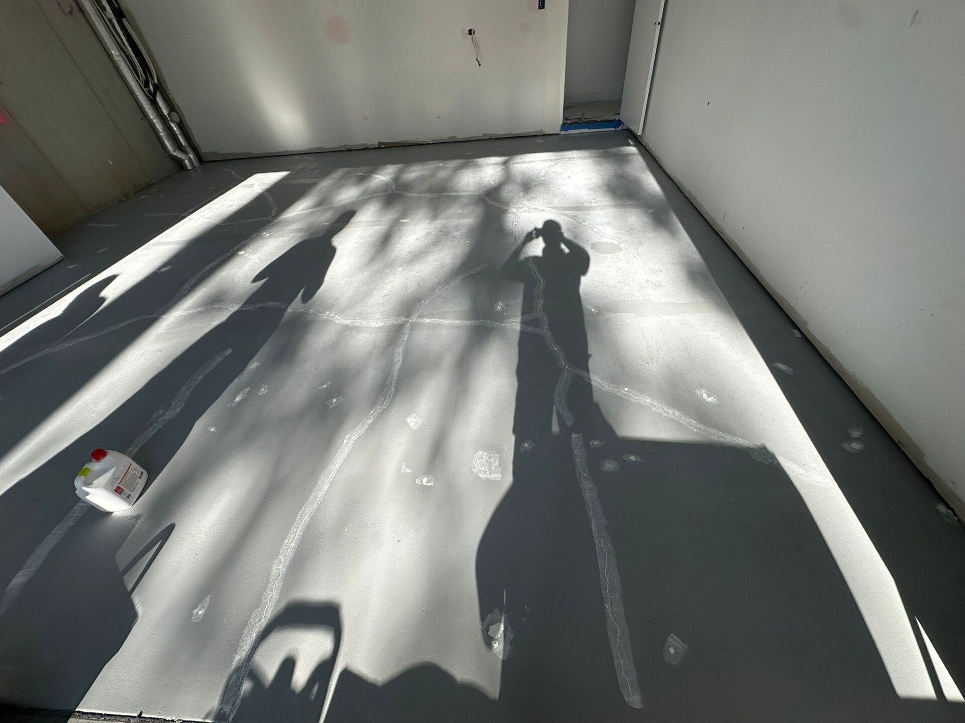 Sealed garage floor with natural light across the surface
